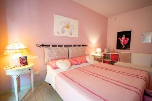 Postel nebo postele na pokoji v ubytování Petali Rosa