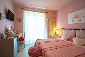 Postel nebo postele na pokoji v ubytování Petali Rosa
