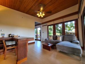 a living room with a couch and a table at Mayura Hill Resort in Sen Monorom