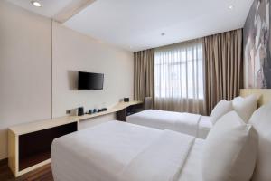 TV a/nebo společenská místnost v ubytování Four Star by Trans Hotel