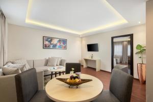 TV a/nebo společenská místnost v ubytování Four Star by Trans Hotel