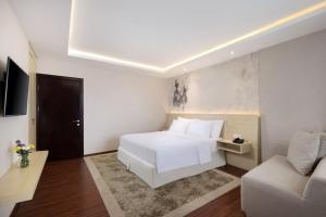 TV a/nebo společenská místnost v ubytování Four Star by Trans Hotel