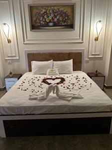 a bedroom with a bed with flowers on it at Pyramids moon view in Cairo