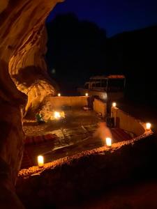 a bus parked in a parking lot at night at Wadi Rum Bedouin Heart in Wadi Rum