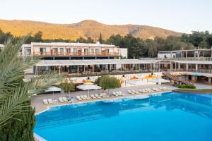 a view of the pool at a resort at DoubleTree by Hilton Bodrum Isil Club All-Inclusive Resort in Torba