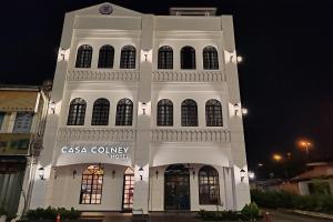 a large white building with a sign on it at Casa Colney Hotel Ipoh in Ipoh