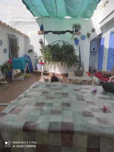 En terrasse eller udendørsområde på Charming House in Puente Mayorga + Sunny Terrace