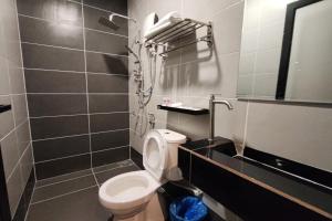 a small bathroom with a toilet and a shower at Casa Colney Hotel Ipoh in Ipoh +52 photos