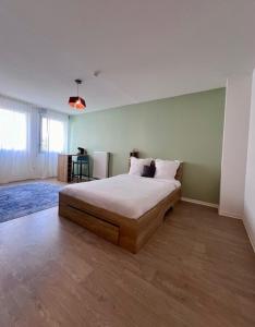 a bedroom with a large bed in a room at UXCO Le Spot in La Rochelle +12 photos