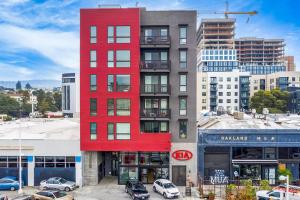 a red building in the middle of a city at Blueground Oakland roof lounge near dining SFO-1718 in Oakland