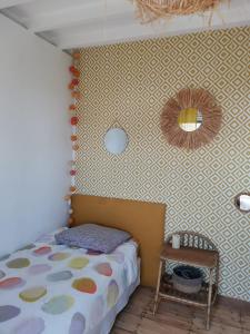 Ένα ή περισσότερα κρεβάτια σε δωμάτιο στο La maison sur la plage