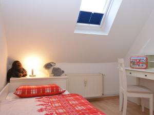 a small bedroom with a bed and a window at Apartment near ski area in Wehrstapel in Sauerland in Meschede
