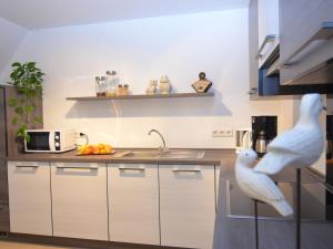 a kitchen with a bird standing on the counter at Apartment near ski area in Wehrstapel in Sauerland in Meschede