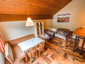 A seating area at Cosy holiday home in the Hochsauerland with terrace at the edge of the forest