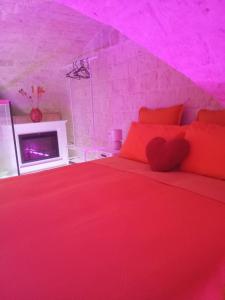 Giường trong phòng chung tại B&B CORTE DI LORENZO A Bari vecchia