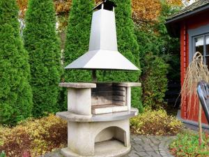 a stone bird bath in a garden with a light at Spacious Apartment in Madfeld with Private Terrace in Madfeld
