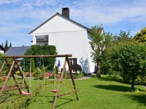 a playground in the yard of a house at Spacious Apartment in Madfeld with Private Terrace in Madfeld
