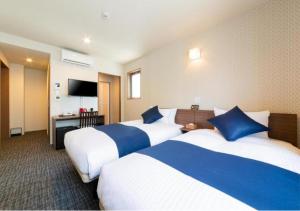Postel nebo postele na pokoji v ubytování HOTEL DORIA