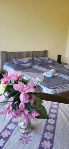 Postel nebo postele na pokoji v ubytování Bástya Apartmanház