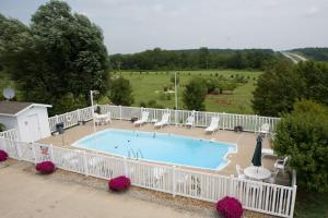 an overhead view of a swimming pool with a white fence at SureStay by Best Western Cameron in Cameron