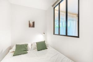 Giường trong phòng chung tại Lavie Maison Balneo garden flat