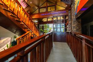 a hallway of a church with wooden railings and a prayer place at UNWND Boutique Hotel Camiguin in Mambajao