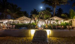 a resort on the beach at night at Sunset Cafe Beach Stay in Gokarna