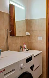 a bathroom with a sink and a mirror at Bella Sicilia in Calatabiano
