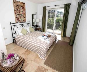 a bedroom with a large bed and a large window at Bella Vista, Kaş Antalya in Kaş +62 photos