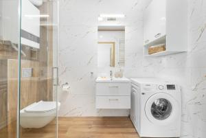 Koupelna v ubytování Nadmorski Apartament z Parkingiem w Ustroniu Morskim by Noclegi Renters