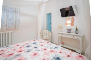 Giường trong phòng chung tại Petali Rosa - Dimora Peonia