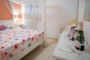 Giường trong phòng chung tại Petali Rosa - Dimora Peonia