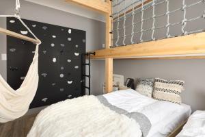 a bedroom with a bunk bed and a climbing wall at Villa Hanasaku Karuizawa Miyota - Vacation STAY 14347v in Miyota