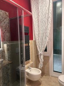 a bathroom with a glass shower and a sink at Villa delle mimose in Sestri Levante