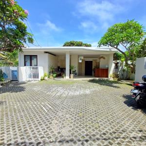 a house with a driveway in front of it at Villa Harmony - Residence in Seminyak