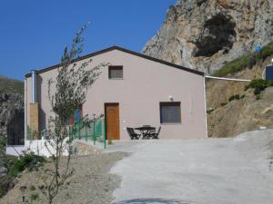a house on the side of a mountain at la villa de Rose in Kalymnos +6 photos