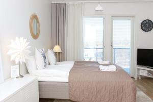 Postel nebo postele na pokoji v ubytování Arctic Suite Evakko