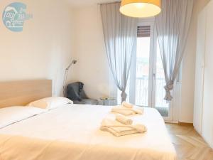 Postel nebo postele na pokoji v ubytování Cappello 9 Tirabora Short Rent