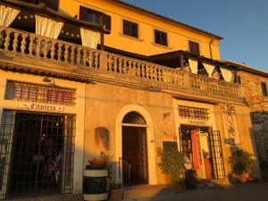 a building with a balcony on the side of it at Bouganville in Rosignano Marittimo
