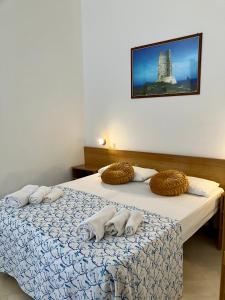 Postel nebo postele na pokoji v ubytování Le Dimore di Ike