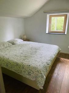 Postel nebo postele na pokoji v ubytování Clos des Rogations