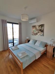 Ένα ή περισσότερα κρεβάτια σε δωμάτιο στο Vegi Apartments +53 φωτογραφίες