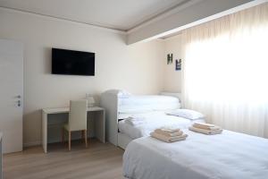 Postel nebo postele na pokoji v ubytování Toscana da aMare