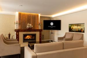 TV a/nebo společenská místnost v ubytování Hotel Regina