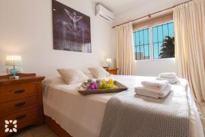 Ein Bett oder Betten in einem Zimmer der Unterkunft Villa Aurora by Abahana Villas