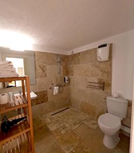 a bathroom with a toilet and a shower at Azur Hotel in Le Lavandou