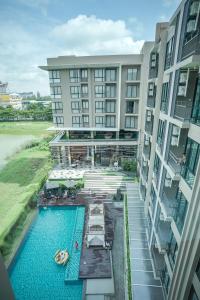 an aerial view of a hotel with a swimming pool at Brique Hotel Chiangmai in Chiang Mai
