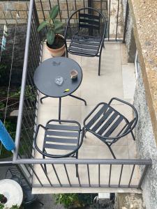 a balcony with two chairs and a table on a balcony at Apartments Gusar in Ulcinj