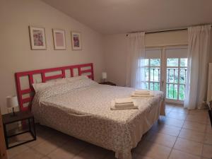 a bedroom with a bed with two towels on it at Casa vacanza "A Castelfranco d'Oglio" in Piadena +19 photos