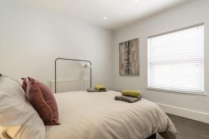 a bedroom with a large bed with a mirror on it at Sparkenhoe House in Hugglescote